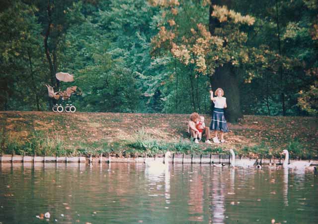 family with stroller at the pond