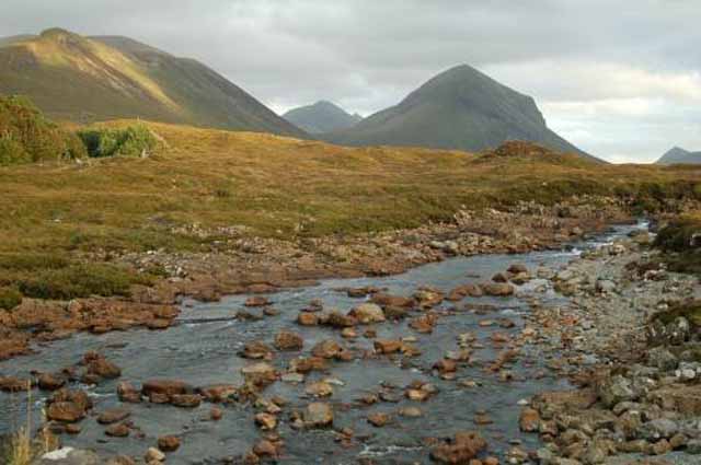 a rocky stream winds through the Cuillins