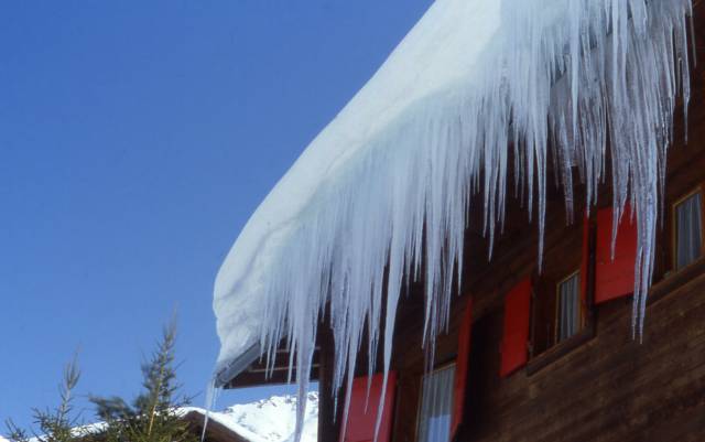 icicles hang from a roof in Verbier